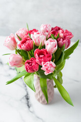 Bouquet of pink peony tulips in vase. Holiday flowers bouquet, wedding or 8 March concept