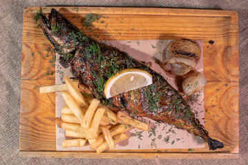 Delicious freshly baked mackerel in josper