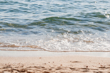 Soft wave of blue sea on sandy beach. 
