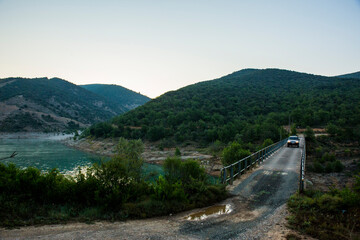 4x4 car crossing dangerous bridge in Aragon, Pyrenees, Spain