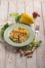pasta with cram sauce lemon peel peanuts and parsley