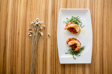 Shrimps on bruschette and design