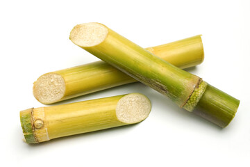 sugar cane and brown sugar on white isolate background