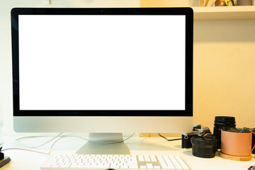 Top view of blank screen computer  with camera, stationery and accessories