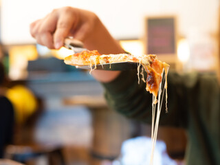 Close up pizza on woodden plate.
