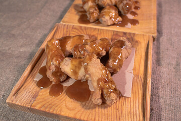 Delicious wings in sauce. Junk food