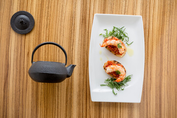 Shrimps on bruschette and design
