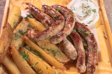 Delicious Provencal sausages with rustic potatoes and onions