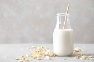 Oat milk. Delicious and healthy vegetarian alternative milk drink. Non-dairy milk - obrazy, fototapety, plakaty