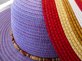 Details of a stylish colourful summer headware hat of a woman