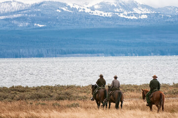 National Park rangers checking things out along Lake Yellowstone;  Yellowstone NP;  Wyoming - obrazy, fototapety, plakaty