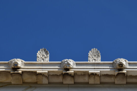 palmette antefix ornaments and lion head water spouts