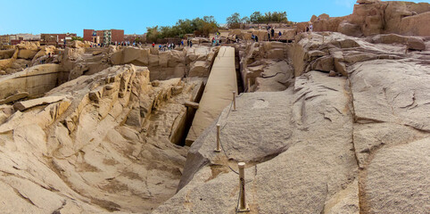 A panorama view of an unfinished obelisk in a quarry near Aswan, Egypt in summer