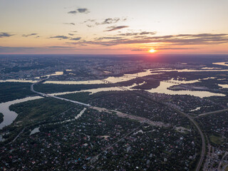 Sunset over the Dnieper River in Kiev. Aerial drone view.