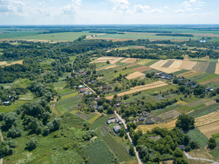 Fototapeta na wymiar Agricultural fields in the Ukrainian village. Aerial drone view.
