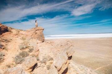 Mountain landscape. Girl in the mountains. Rocks, mountains, sea.