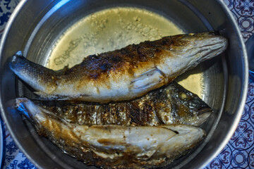 pot with roasted fish