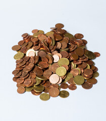 a pile of loose change. used european coins on white background. Euro