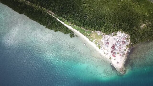 Top view of a small island village surrounded by mangrove forests in Bohol, Philippines.