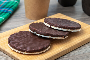Rice cakes with chocolate on a kitchen table