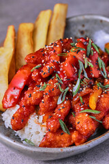 Sweet and Sour Chicken with rice and fries.