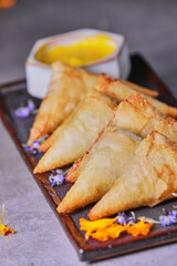 Shrimp Gyoza with huancaina sauce.