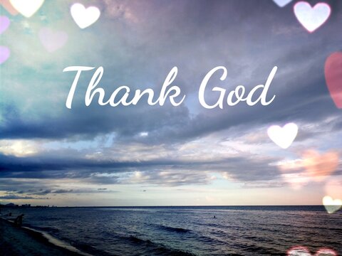 Dramatic sky over the sea with text saying thank God. Concept about relaxation and thank God for holiday. - Powered by Adobe