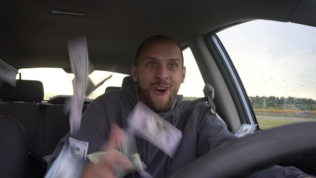 Happy driver with big money dollars. Success. Concept on the topic of lottery, winnings, slot machines, business success.