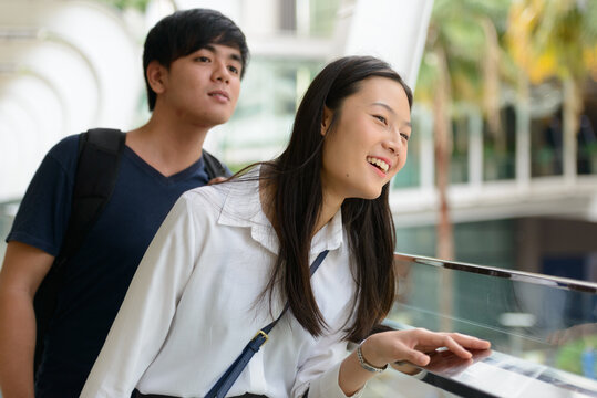 Portrait of young Asian couple together at the footbridge