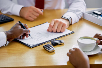 african customer signing contract at car dealership, consultant help buyers to make purchase