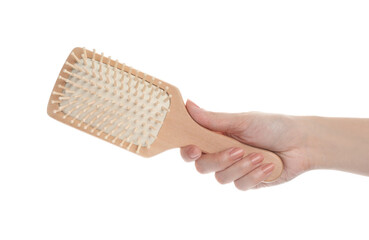 Woman holding wooden hair brush on white background, closeup