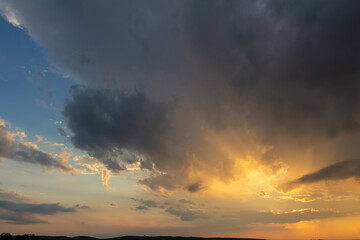 Fototapeta na wymiar Nice sunset dramatic sky with land silhouette, Palava Czech republic