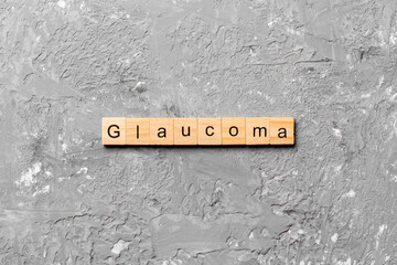 GLAUCOMA word written on wood block. GLAUCOMA text on cement table for your desing, concept