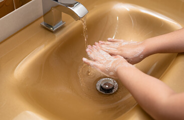Girl washing her hands