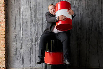 smiling fat caucasian businessman is not ready to give someone his profit on oil production, man...