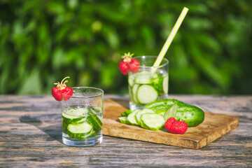 drink made from fresh chopped cucumbers with ripe strawberries. summer concept. refreshing water