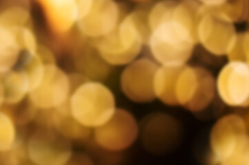 Magic shiny bokeh lights, fantastic abstract background. Beautiful golden glowing pattern. copy space.