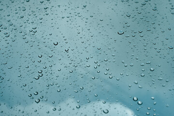 Rain drops on window pane glass surface