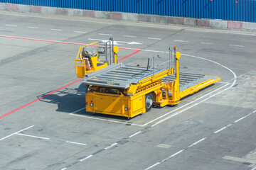 Special equipment at the airport platform elevator for lifting and loading heavy loads into the...