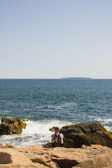 A hiker takes a break in Acadia national park