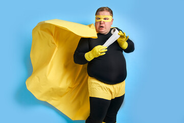 now there will be a misunderstanding, fat superhero urgently needs a toilet, he holds toilet paper...