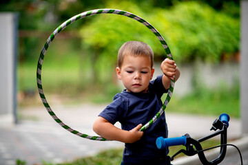 Cute little boy holding a hula ring