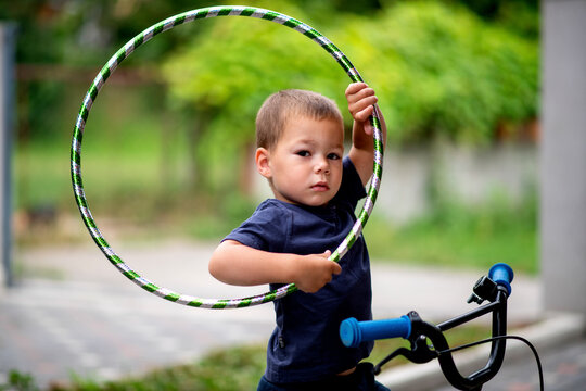 Cute little boy holding a hula ring