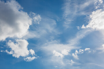 Scenic cloudscape with dramatic light. Clear blue sky with clouds