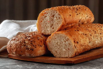 Fresh bread with sesame seeds, seeds and oatmeal on the table