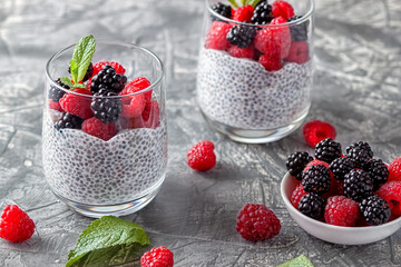 Vegan healthy food. Chia pudding with coconut milk, fresh raspberries and blackberries