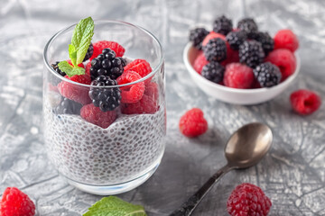 Vegan healthy food. Chia pudding with coconut milk, fresh raspberries and blackberries