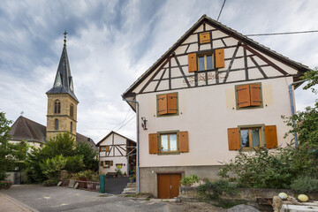 Fototapeta na wymiar View on Eglise de Magstatt-le-Bas and timber framing house