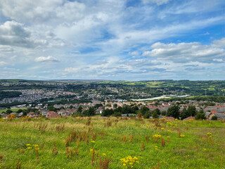 Fototapeta na wymiar Panoramic view, over Shipley and Bradford, with grass, houses, and fields in the distance near, Bradford, UK