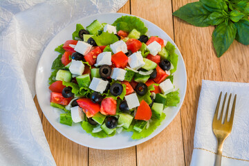 Mediterranean salad with feta cheese, tomatoes, cucumbers and olives